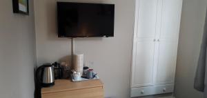 a flat screen tv hanging on a wall at The Grapes in Southampton +144 photos