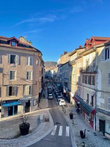 a view of a city street with buildings at L'échappée Jurassienne - Tout équipé au calme in Saint-Claude