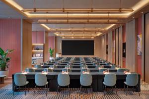 a large conference room with a large table and chairs at Hyatt Centric The Ring Chengdu in Chengdu