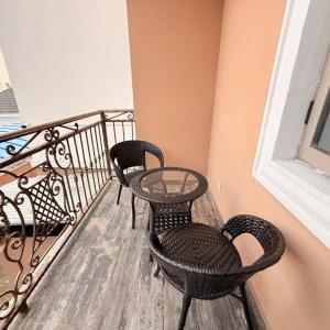two chairs and a table on a balcony at Star Wish Business Hotel in Lagos