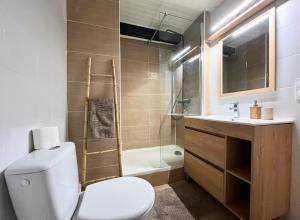 a bathroom with a toilet and a sink and a shower at T4 proche centre et stade de Rugby in Perpignan +14 photos
