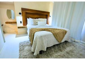 a bedroom with a large bed with a rug at Tulipán Azul Depa Renovado 2 Recámaras in Oaxaca City