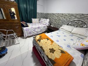 a bedroom with two beds in a room at شاليه بقريه روجينا العين السخنه in Ain Sokhna +17 photos