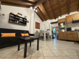 a living room with a couch and a table at House A73 in Lezzeno