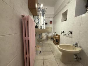 a bathroom with a sink and a toilet and a sink at House A73 in Lezzeno
