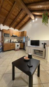 a large kitchen with a table in the middle of it at House A73 in Lezzeno +14 photos