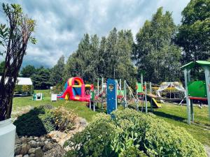 a park with a playground with a slide at KARCZMA-KOSZWICE in Koszwice