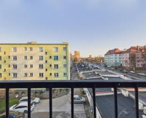 a view of a city street with cars and buildings at Mieszkanie na Alei in Głogów