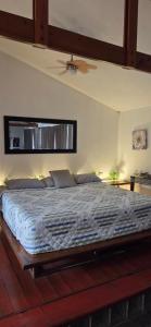a bedroom with a large bed with a ceiling at Private Apt, AC, Jacuzzi, parking Centro in Escuintla