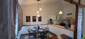 a kitchen with a table and chairs in a room at Private Apt, AC, Jacuzzi, parking Centro in Escuintla