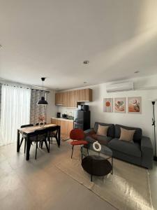 a living room with a couch and a table at Casa Joseph in Aga