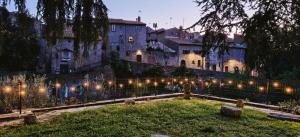 a row of lights in front of a building at The Garden Suites in Viterbo