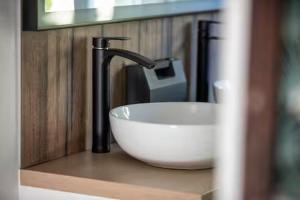 a sink with a faucet in a bathroom at Au Gré Des Lis - La Suite Du Chêne in Belval-sous-Châtillon +30 photos