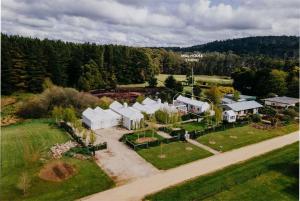 an aerial view of a farm with white buildings at Mill House Studio - a romantic retreat in Lyonville