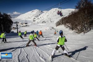 a group of people skiing down a ski slope at Locanda Del Castello Bed an Breakfast in San Panfilo dʼOcre