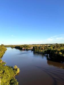 an aerial view of a river with trees in the distance at Carmelo Postal in Carmelo +16 photos
