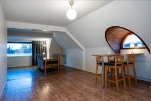 a dining room with a table and chairs at Port Hotel Apartments in Karlshamn