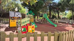 a playground with a slide and a slideintend at Cozy Duplex in Arles
