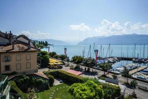 a view of a marina with boats in the water at Rivage Hotel Restaurant Lutry in Lausanne