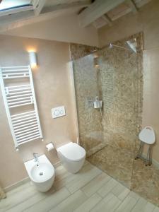 a bathroom with a shower and a toilet and a sink at AMA AFFITTACAMERE in Albenga +20 photos
