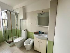 a bathroom with a sink and a toilet and a shower at City & Sea View T1 with Balcony in Lazareto +7 photos