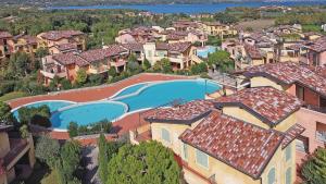 an aerial view of a house with a swimming pool at Borgo Del Torchio - Gardagate in Manerba del Garda