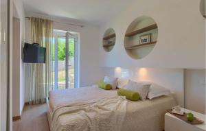 a bedroom with a bed with two mirrors on the wall at Villa Hemera - Oasis of Peace and Privacy by Istrabook in Kršan +40 photos