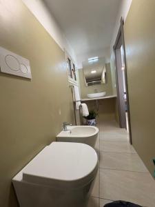 a bathroom with a toilet and a sink at A due passi dal centro in Noto +46 photos