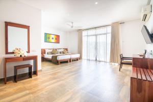 a living room with a couch and a table at Oak Ray Regency in Kandy