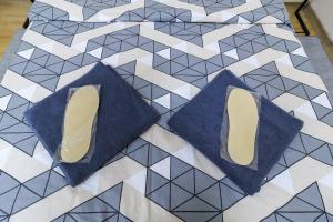 a pair of shoes sitting on a tiled floor at Hostel in the center in Kyiv