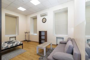 a living room with a couch and a table at Hostel in the center in Kyiv