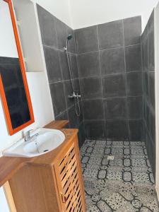 a bathroom with a sink and a shower at Villa Bella Vista in Hell-Ville