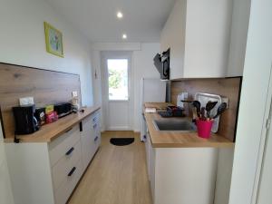 a kitchen with a sink and a counter top at Yvéro in Quend-Plage