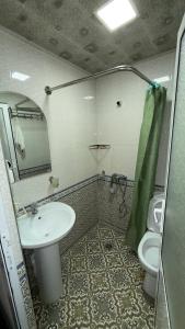 a bathroom with a sink and a toilet at Alisher hotel in Samarkand +44 photos