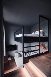 two bunk beds in a room with a mirror at Hotel Gerl in Salzburg