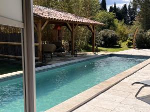 a swimming pool with a gazebo in a yard at Mas d'Auseu in Cavaillon +63 photos