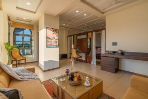 a living room with a couch and a table at Perfectstayz premium stepwell by the lake in Udaipur