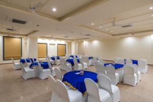 a room with blue and white tables and chairs at Perfectstayz premium stepwell by the lake in Udaipur +134 photos
