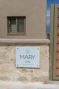 a sign for marry villa on the side of a building at Amnia Villas with Private Pool in Kapsalianá