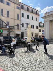 a man standing on a street in a city at Monica's home in Ariccia