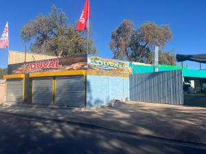 a dunkin donuts building with a sign on it at Duval in Calama