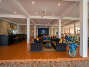 a large living room with couches and a bar at Aqua Hotel Yala in Yala