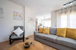 a living room with a couch and a chair at Martinica By Silastur in Ferrera