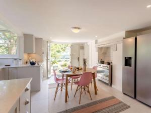 a kitchen with a table and chairs in a kitchen at 4 Bed in Pulborough oc-89346 in Fittleworth