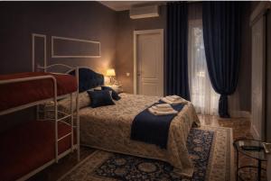a bedroom with a bed and a window with curtains at Il Borgo del Castello in Rota d'Imagna +18 photos