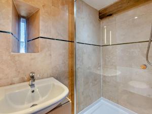 a bathroom with a sink and a shower at 2 Bed in Launceston oc-95236 in Saint Giles on the Heath +16 photos
