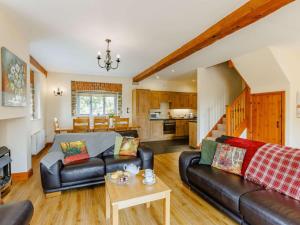 a living room with a couch and a table at 3 Bed in Launceston oc-88858 in Saint Giles on the Heath