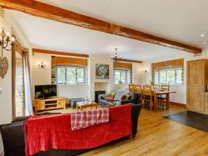 a living room with a couch and a table at 3 Bed in Launceston oc-88858 in Saint Giles on the Heath