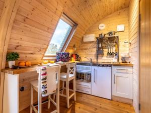 a kitchen with white appliances and a wooden ceiling at 1 Bed in Padstow oc-77748 in Padstow