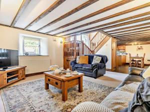 a living room with a couch and a coffee table at 2 Bed in Launceston oc-92551 in Saint Giles on the Heath